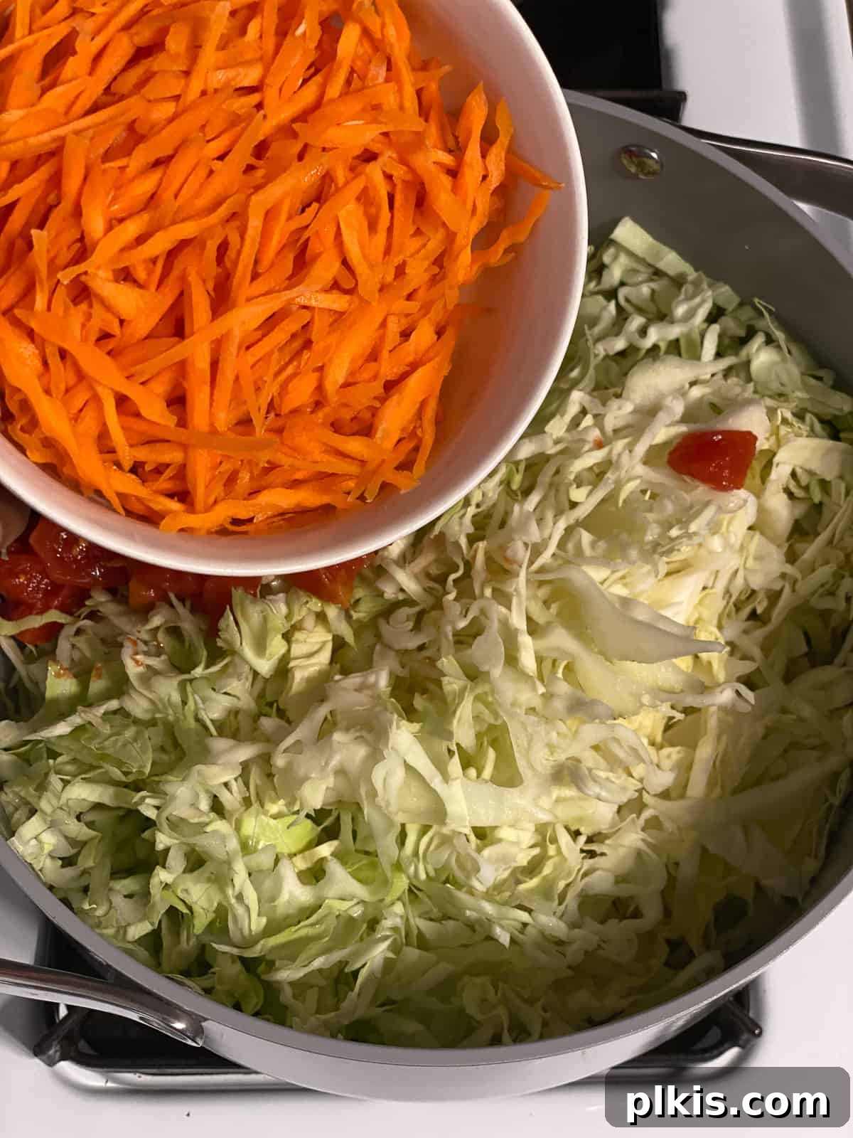Zesty Plant-Based Hot and Sour Soup 7 process shot of adding carrots to pan