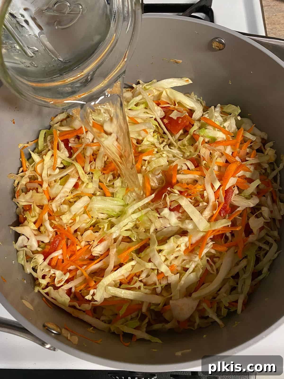 Zesty Plant-Based Hot and Sour Soup 9 process shot of adding water to pan
