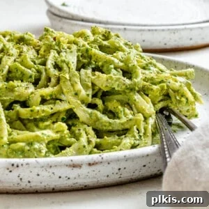 completed Amazing Avocado Pesto Pasta plated against a light surface