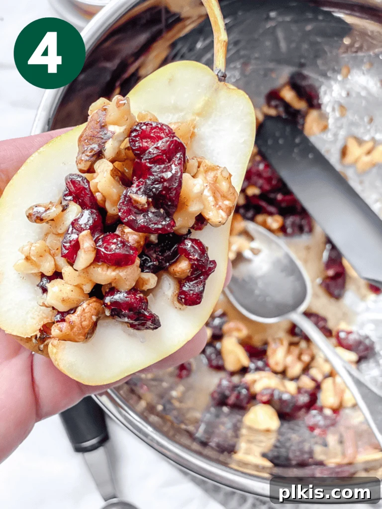 Sweet Baked Pears with Nutty Fruit Filling 7 Halved pears with their cores removed, now generously stuffed with a delicious mixture of nuts and dried fruit.