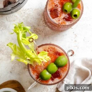 Alkolsüz Bloody Mary Tarifi 8 Two Virgin Bloody Mary drinks in glasses, garnished with celery and olives.