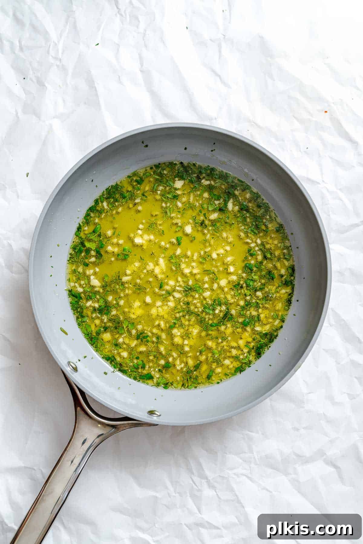 Aromatic Garlic Herb Vegan Focaccia 4 Process shot showing herb mixture in a bowl.