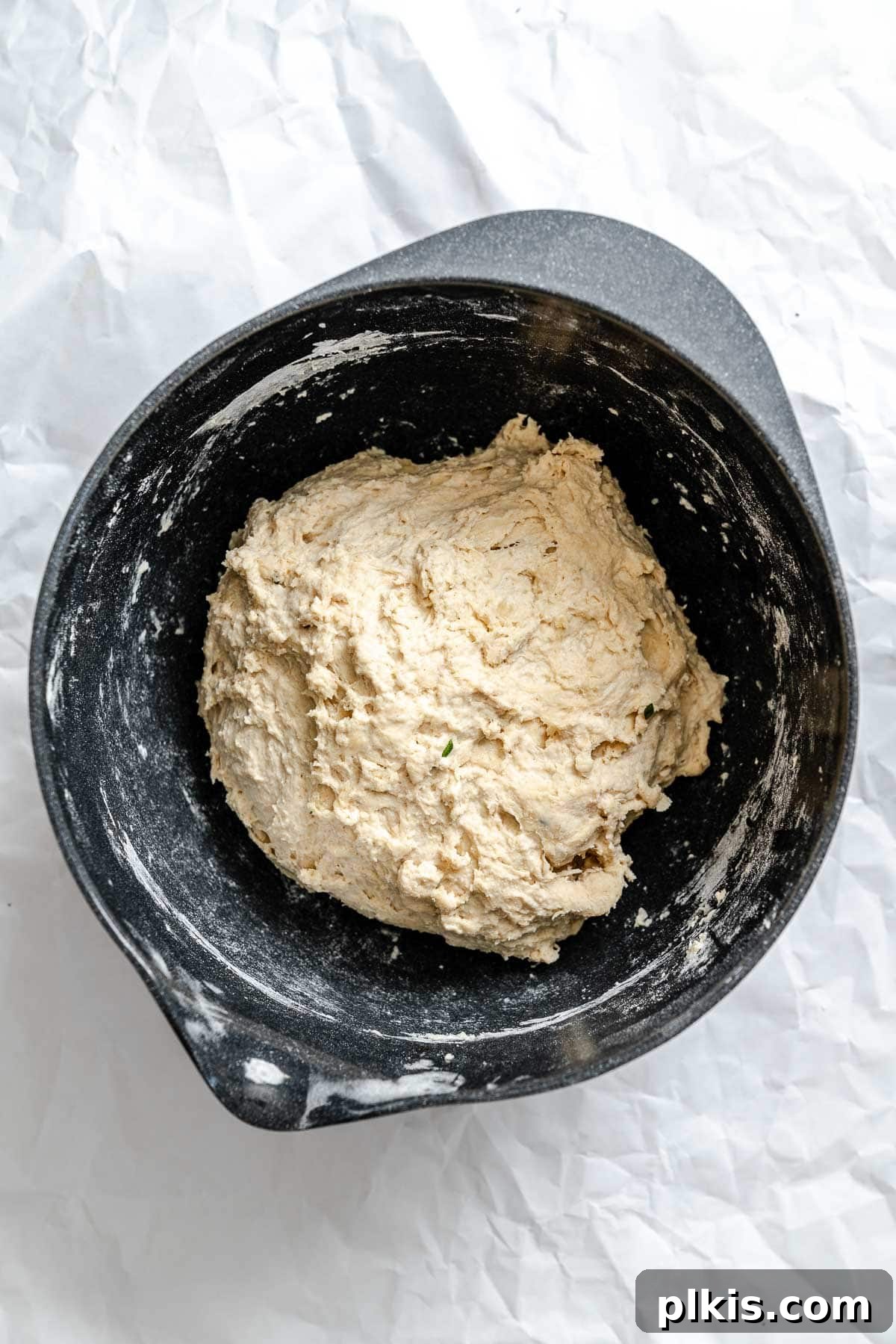 Aromatic Garlic Herb Vegan Focaccia 6 Process shot showing ball of dough in pan.