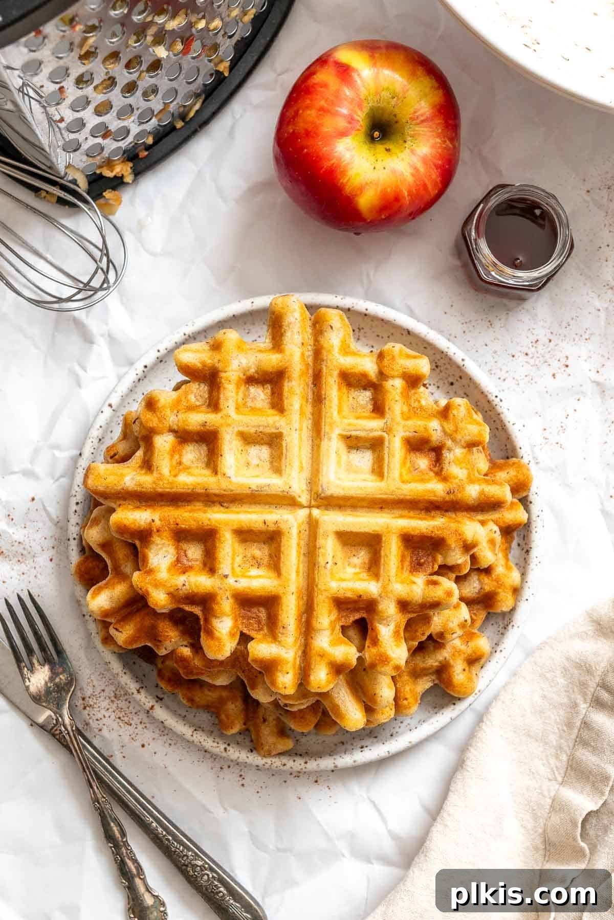 Completed Apple Cinnamon Waffles (Eggless) stacked on a plate.