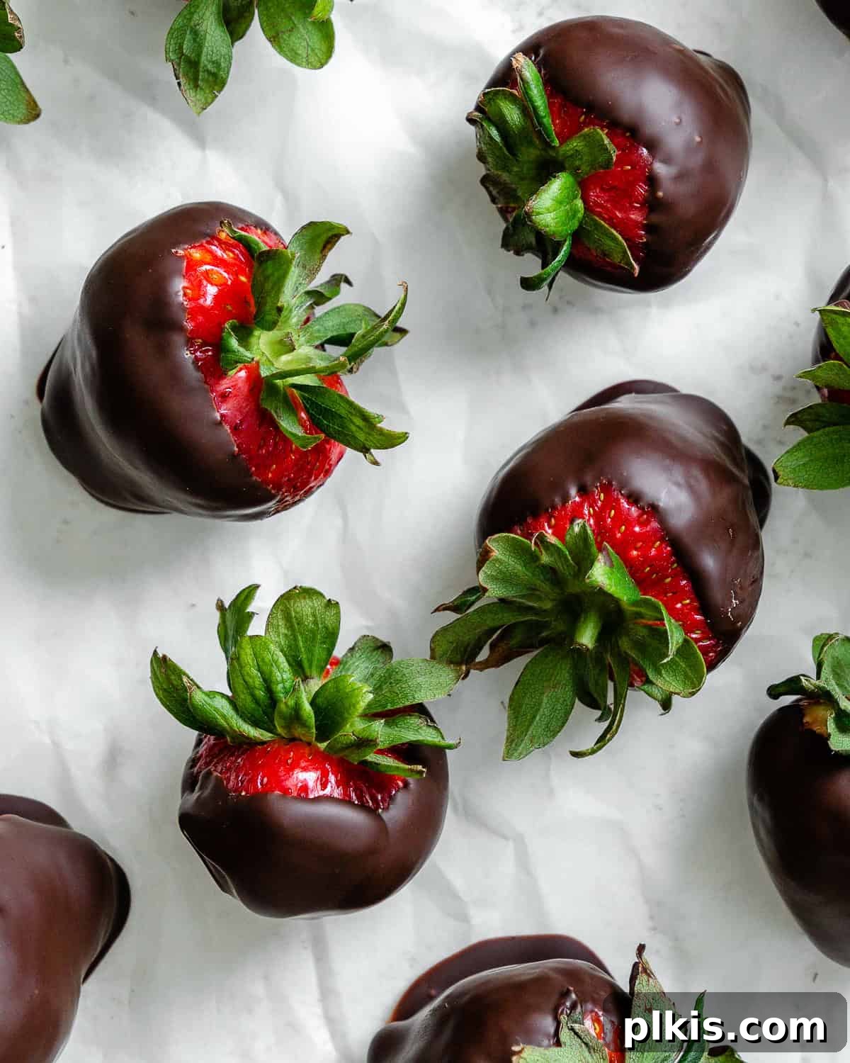 Decadent Vegan Strawberry Bites 2 Several completed Chocolate Dipped Strawberries on a white surface.