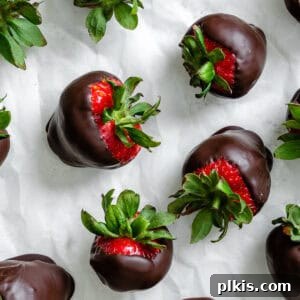 Decadent Vegan Strawberry Bites 8 several completed Chocolate Dipped Strawberries on a white surface