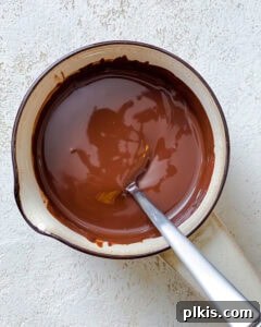 Decadent Vegan Strawberry Bites 9 process shot showing melted chocolate in a bowl