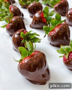 Decadent Vegan Strawberry Bites 11 several completed Chocolate Dipped Strawberries on a white surface