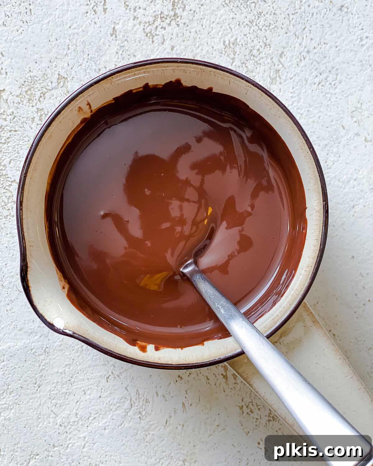 Decadent Vegan Strawberry Bites 4 process shot showing melted chocolate in a bowl