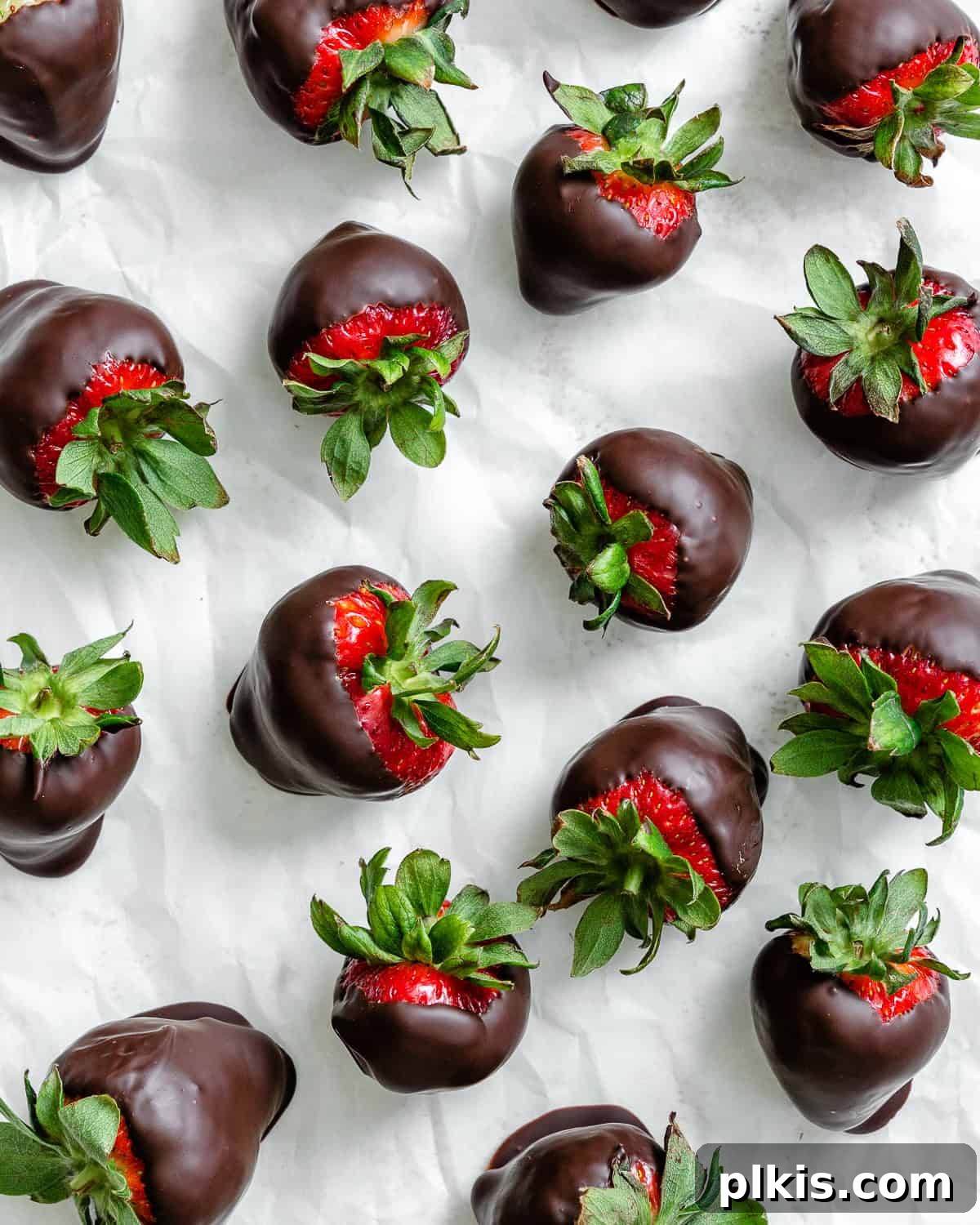 Decadent Vegan Strawberry Bites 6 Several completed Chocolate Dipped Strawberries on a white surface.