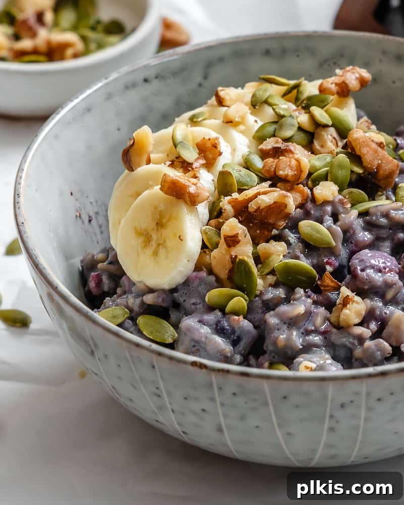 Mastering Stove-Top Oatmeal: Perfect Consistency and Delicious Variations 10 A vibrant bowl of creamy stovetop oatmeal with a variety of colorful toppings, emphasizing the endless customization options.