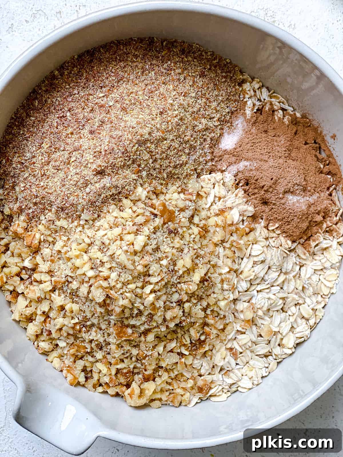 Simple Peanut Butter Granola Clusters 4 process shot of ingredients mixed together in a bowl