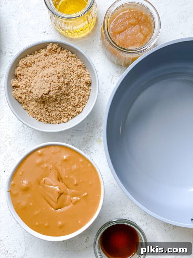 Simple Peanut Butter Granola Clusters 5 ingredients for Easy Peanut Butter Granola measured out against a white surface