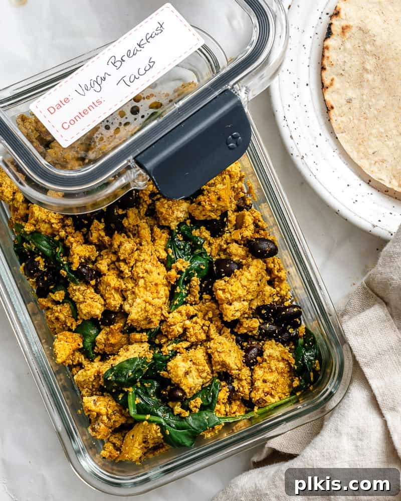 Plant-Powered Morning Tacos 10 Completed Vegan Breakfast Tacos in a storage container.
