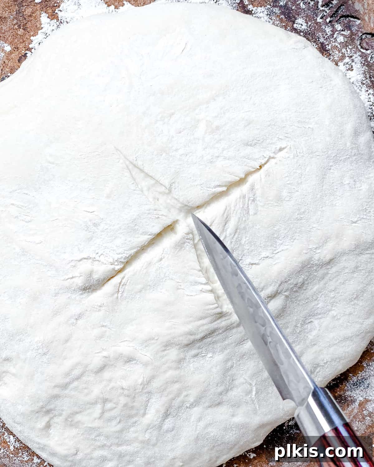Lazy Baker's Crusty Loaf 14 process shot of cutting a small slit onto top of dough