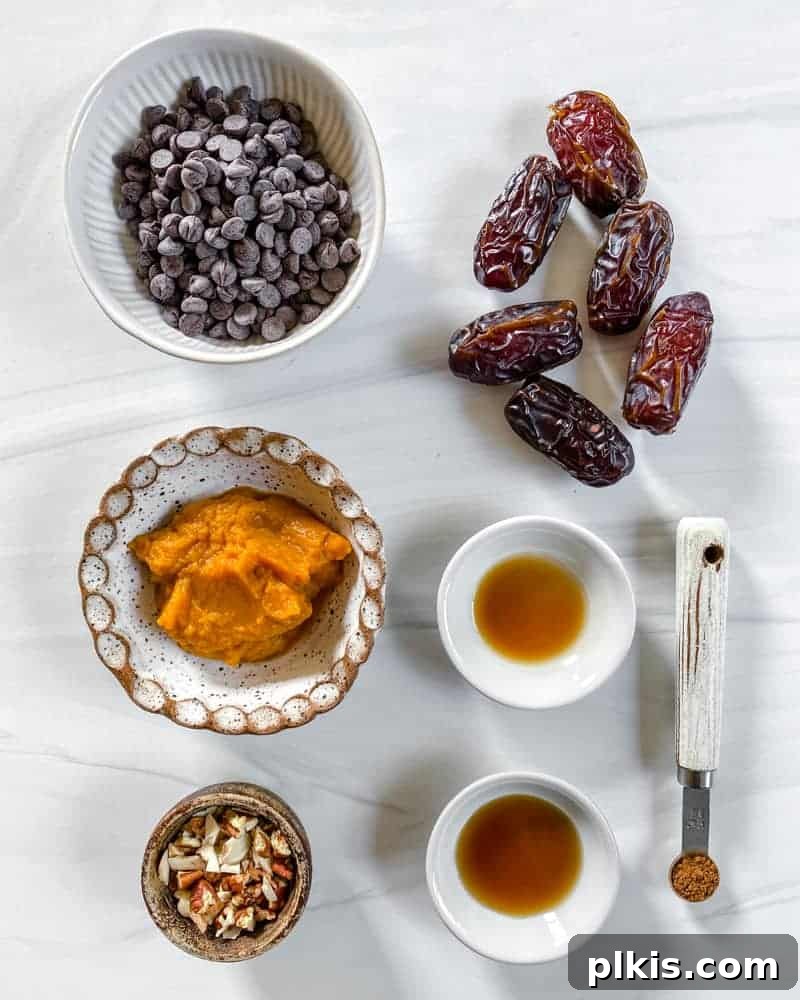 Spiced Pumpkin Date Delights 4 A beautiful flat lay of all Pumpkin Stuffed Dates ingredients displayed neatly on a white marble surface, ready for preparation.