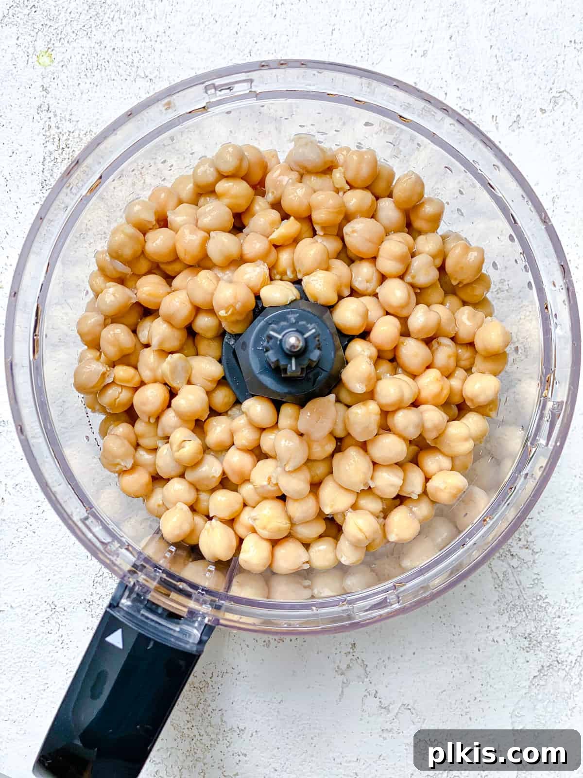 Crispy Healthy Falafel Baked or Air Fried 4 process shot of adding chickpeas to food processor