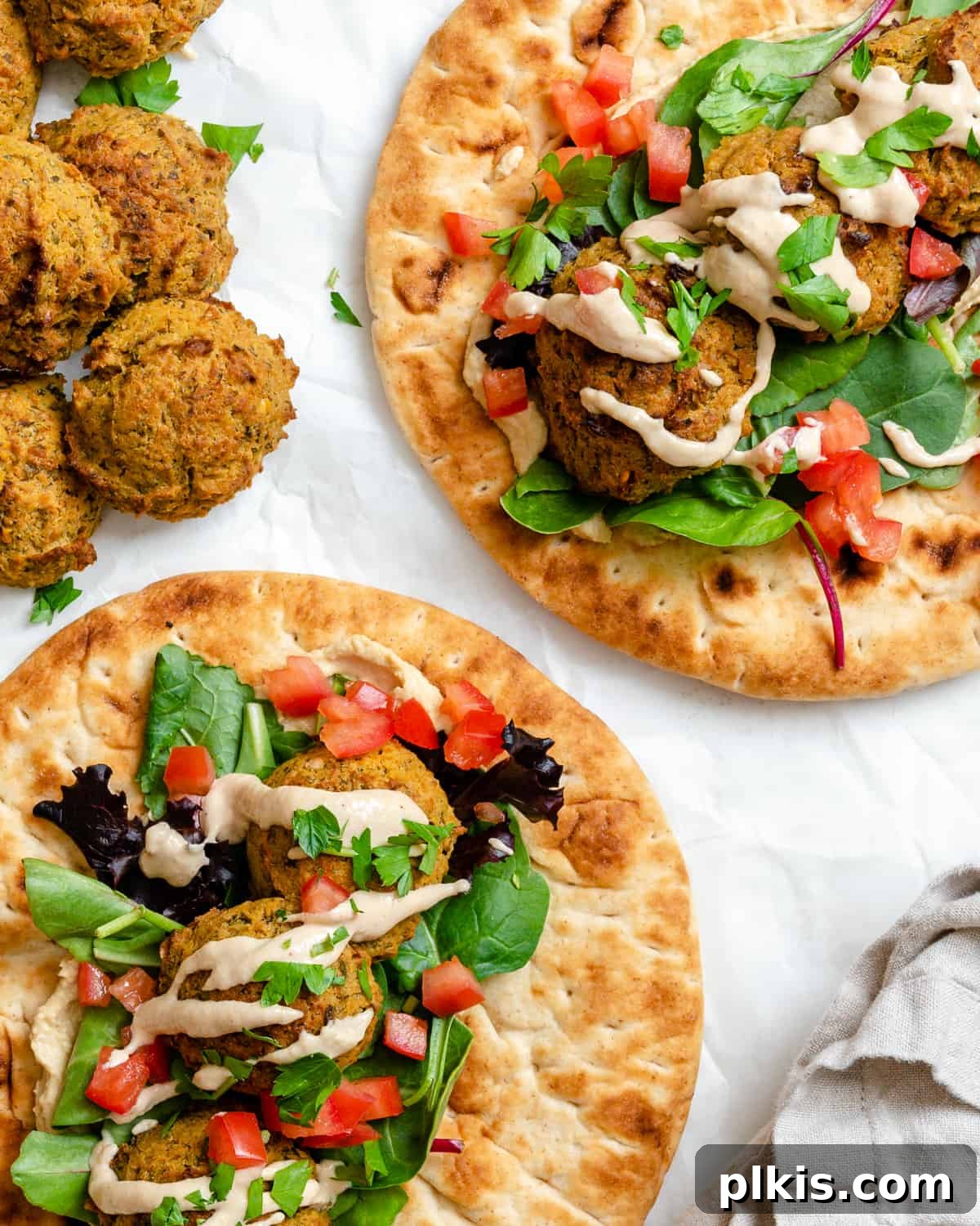 Crispy Healthy Falafel Baked or Air Fried 9 completed Healthy Baked Falafel on bread against a white background