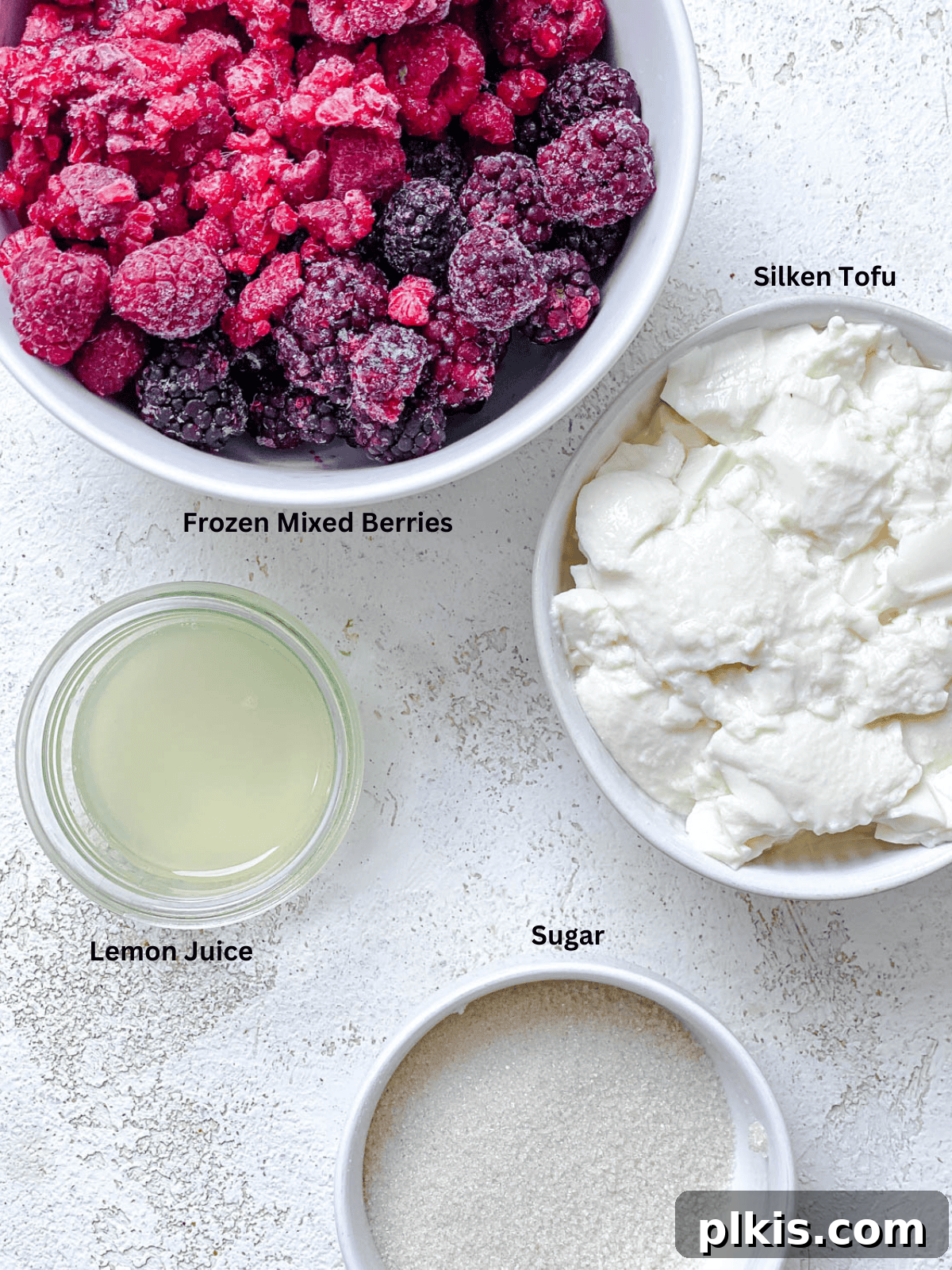 Instant Berry Tofu Nice Cream 3 Carefully measured ingredients for 5-Minute Berry Tofu Ice Cream laid out on a clean white surface.