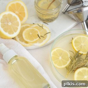 Zesty Rosemary Refresh 4 Lemon Rosemary room spray in a bottle next to sliced lemons.