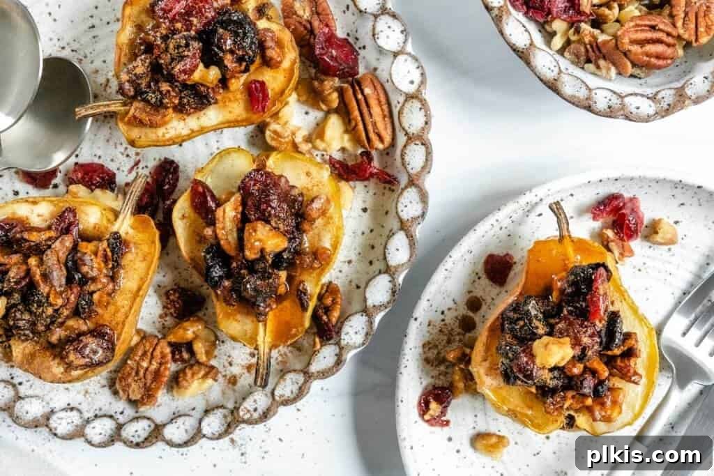 20 Delicious Vegan Autumn Desserts 2 Vegan Baked Pears plated against white background