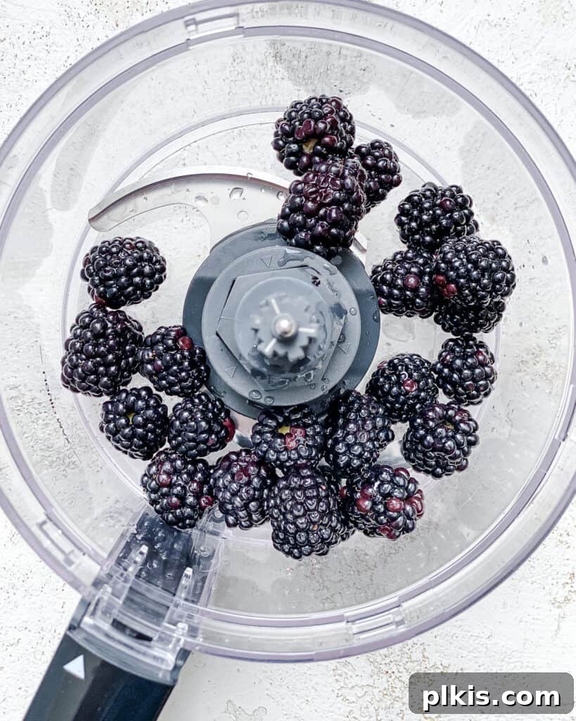 Effortless Blackberry Dressing 4 Process shot showing blackberries in a food processor.