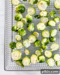 Crispy Air Fryer Brussels Sprouts 11 brussels sprouts spread out on a wire rack