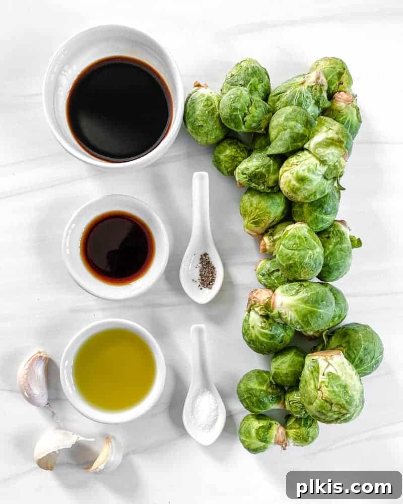 Crispy Air Fryer Brussels Sprouts 4 Air Fryer Brussels Sprouts Ingredients measured out against a white background