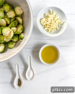 Crispy Air Fryer Brussels Sprouts 7 brussels sprouts in a bowl with ingredients in the background