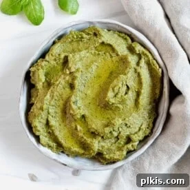 completed Sunflower Seed Pesto in a white bowl against a white background