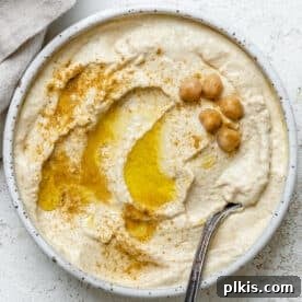 completed Easy Hummus in a bowl against a light background