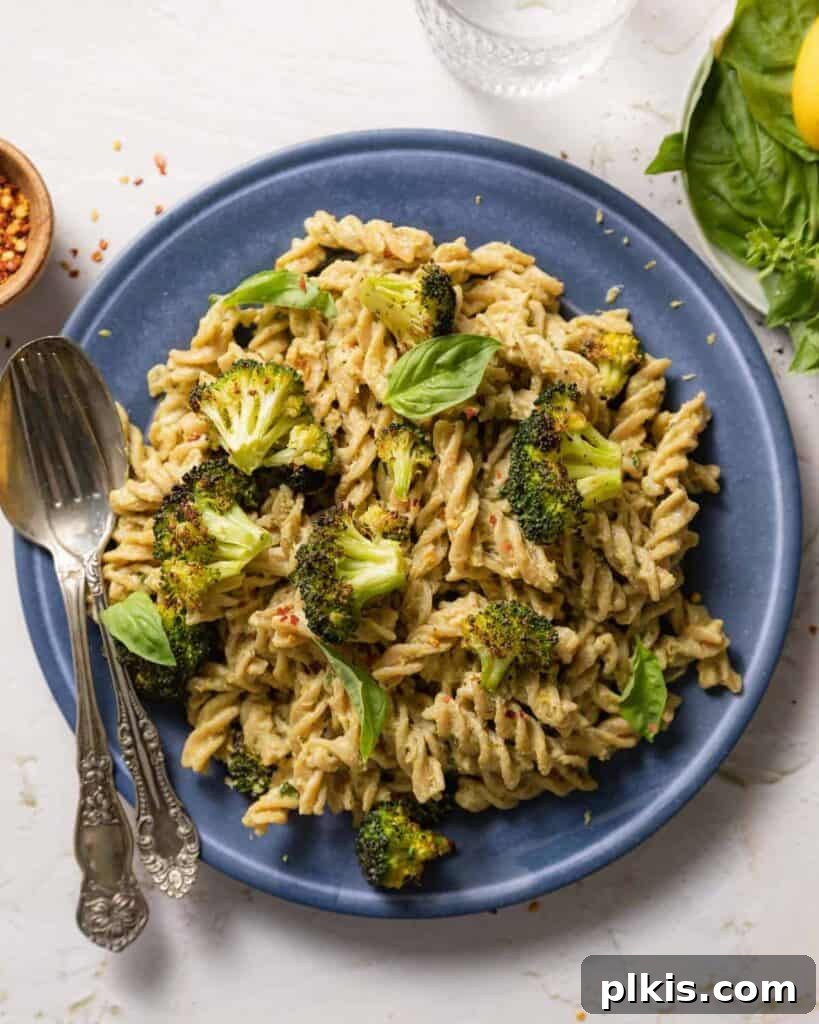 20 Effortless Plant-Based Pasta Dishes for Delicious Dinners 35 finished Tahini Pasta in a blue plate against a white background