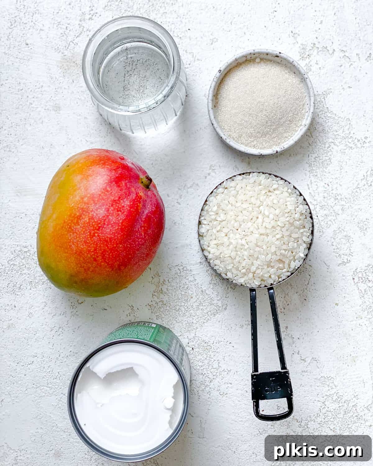 Sunshine Mango Sticky Rice 3 ingredients for Thai Mango Sticky Rice measured out against a white surface
