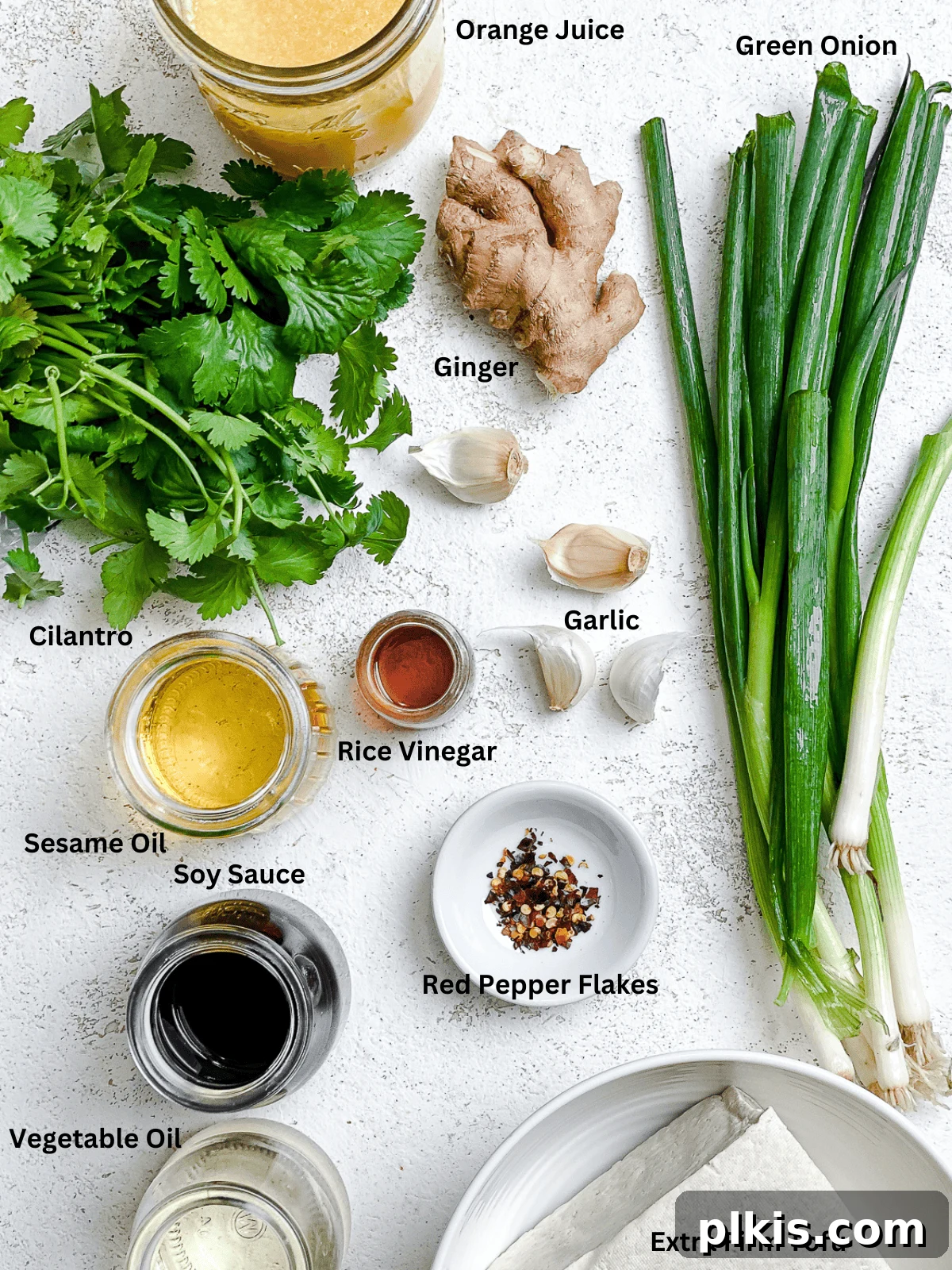 Ultimate Ginger Marinated Tofu 3 Ingredients laid out for making the best marinated orange ginger tofu.