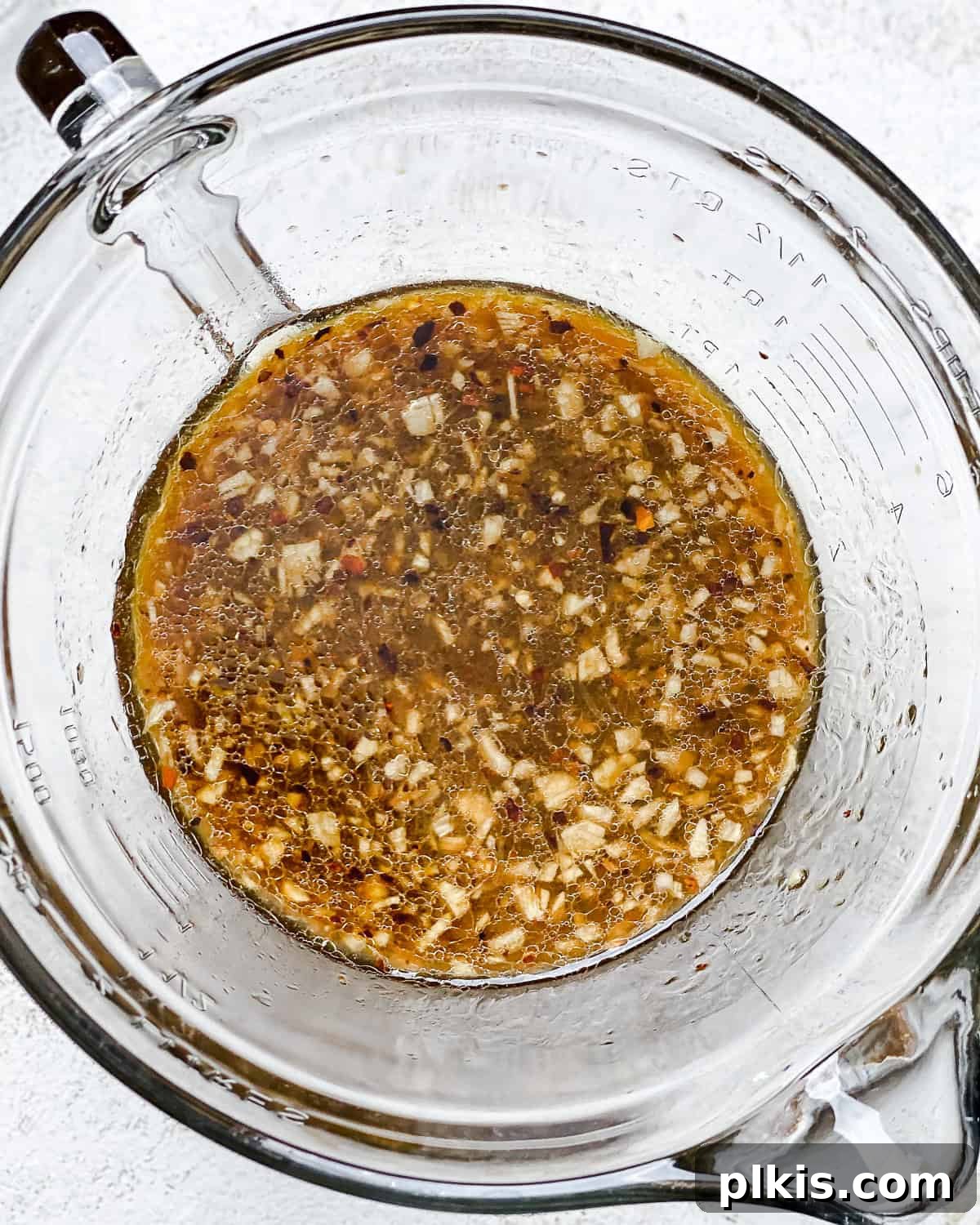Ultimate Ginger Marinated Tofu 5 Process shot showing ginger tofu marinade in a glass bowl.