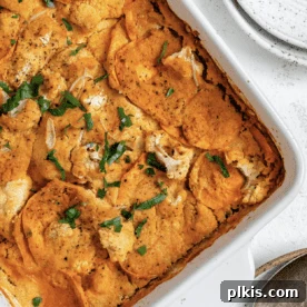 45 Mouthwatering Vegan Thanksgiving Recipes 31 Completed Healthy Vegan Cauliflower Casserole in a baking dish, against a pristine white background.
