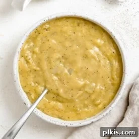 45 Mouthwatering Vegan Thanksgiving Recipes 39 Completed Easy Vegan Gravy in a bowl against a light surface.