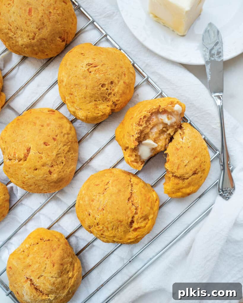 45 Mouthwatering Vegan Thanksgiving Recipes 45 Completed sweet potato biscuits cooling on a rack against a white surface.