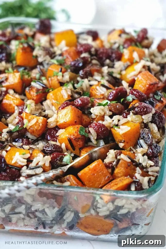 45 Mouthwatering Vegan Thanksgiving Recipes 51 A rustic butternut squash casserole, freshly baked and served in a glass tray.