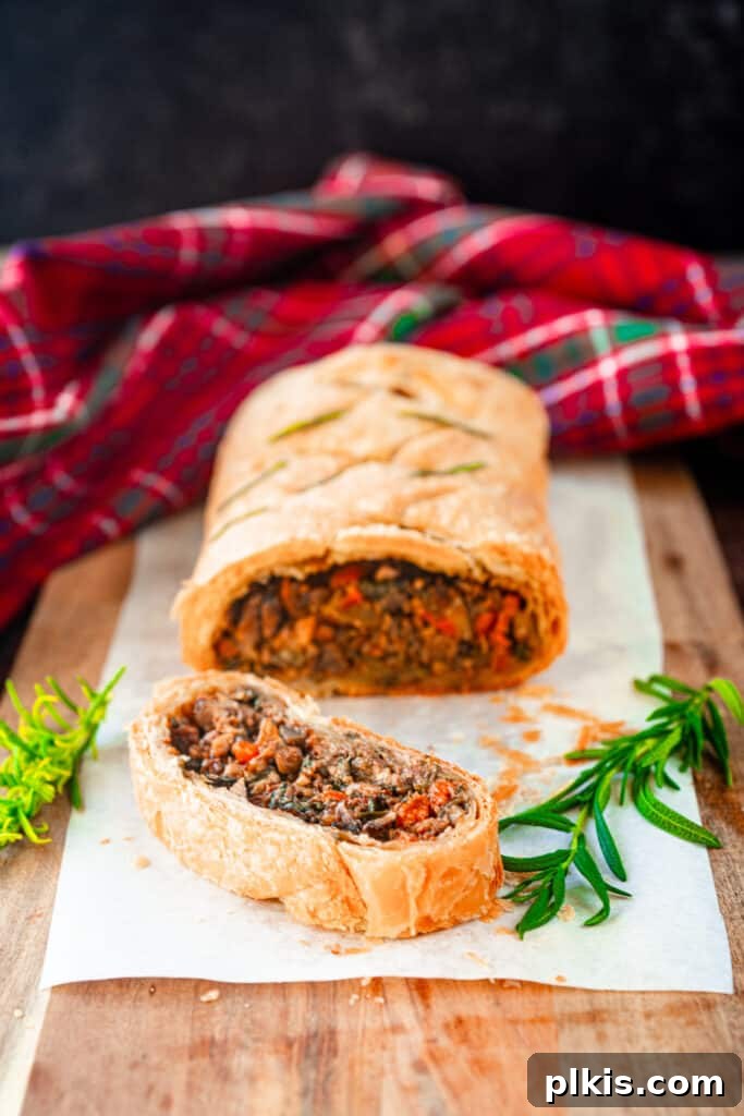 45 Mouthwatering Vegan Thanksgiving Recipes 55 An elegant Vegan Wellington, baked to golden perfection, ready to be sliced and served for a holiday feast.
