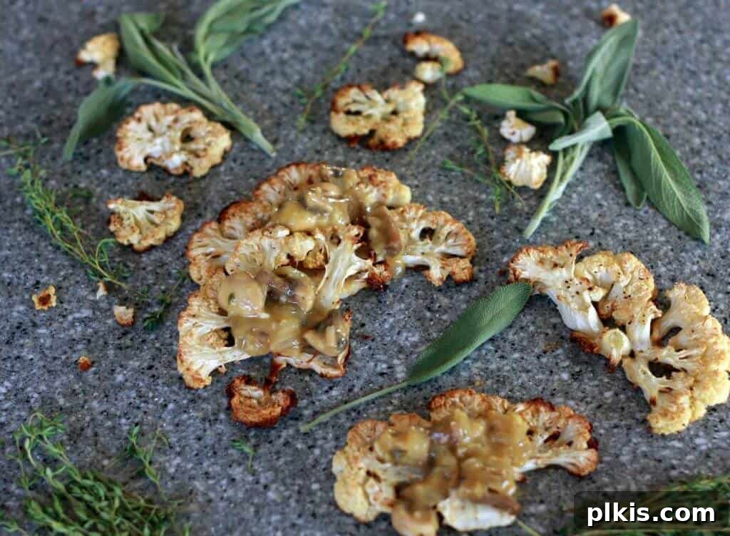 45 Mouthwatering Vegan Thanksgiving Recipes 62 A plate of perfectly cooked Cauliflower Steaks, topped with savory gravy.