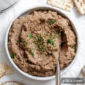 45 Mouthwatering Vegan Thanksgiving Recipes 5 The BEST Mushroom Pâté served in a bowl, ready to be enjoyed.