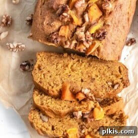 45 Mouthwatering Vegan Thanksgiving Recipes 67 Completed pumpkin bread, sliced and presented on parchment paper.