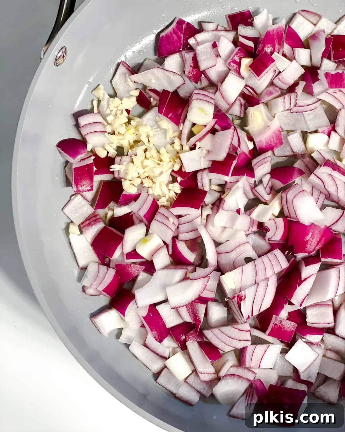 Refreshing Summer Pasta Salad 4 Process shot showing onions cooking in a pan until translucent.