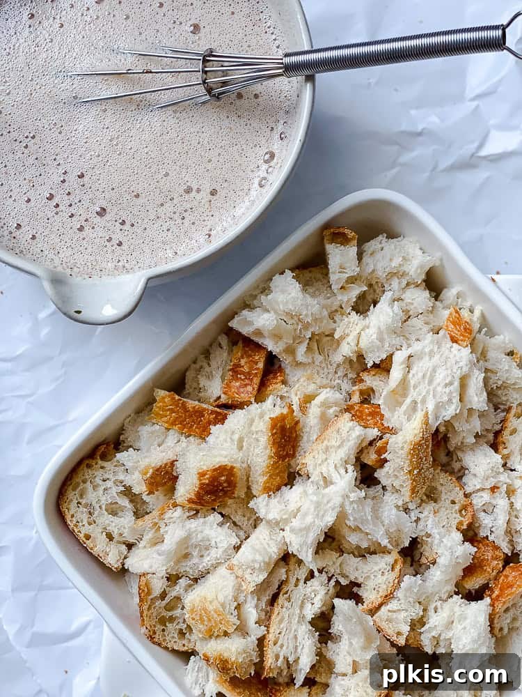 Decadent Vegan Bread Pudding 6 Process shot showing the baking dish filled with bread chunks positioned next to the bowl containing the mixed vegan custard mixture, ready for combination.