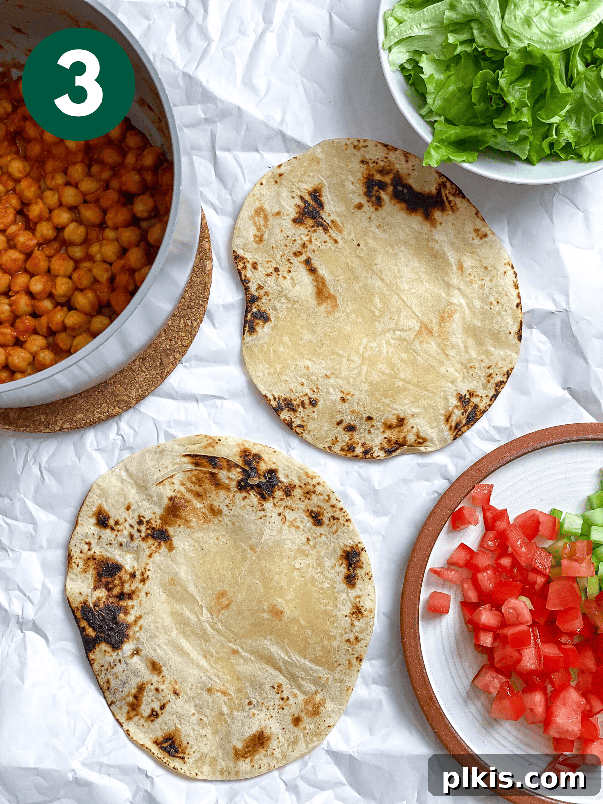 Tangy BBQ Chickpea Wraps 7 Assembling a BBQ Chickpea Wrap, with the flavorful filling laid out on a tortilla.