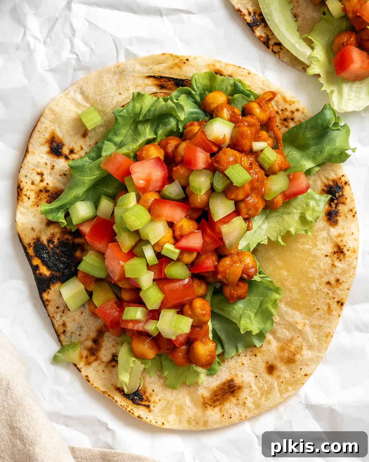 Tangy BBQ Chickpea Wraps 8 A completed BBQ Chickpea Wrap, showcasing the vibrant and delicious filling.