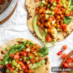 Completed BBQ Chickpea Wraps on a white surface.