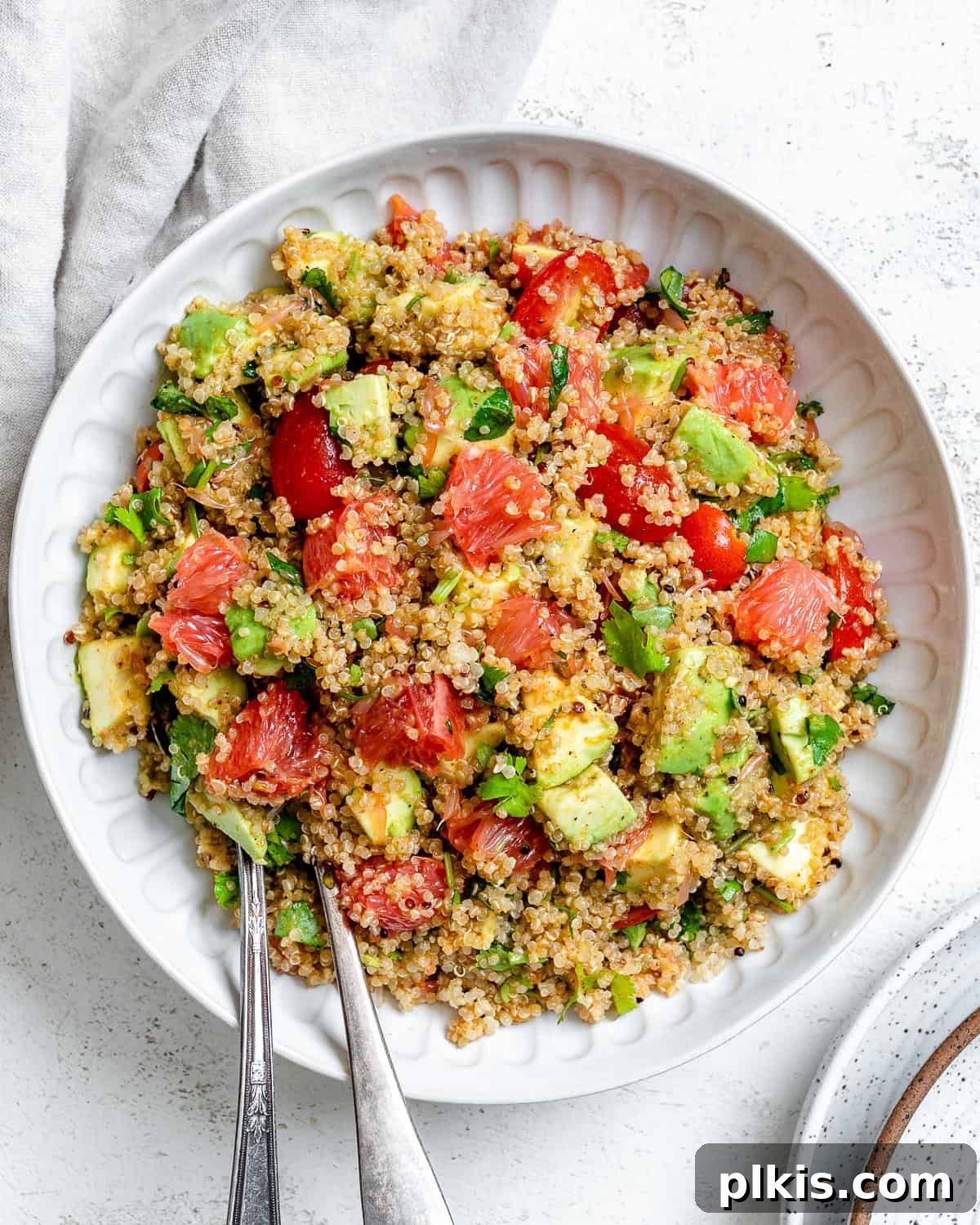 Completed Avocado Quinoa Salad with Grapefruit on a plate, showcasing its vibrant colors and fresh ingredients.