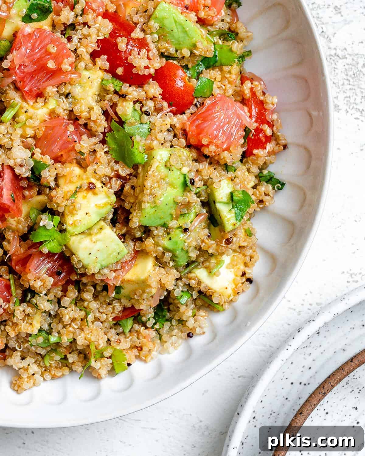 Another enticing view of the completed Avocado Quinoa Salad with Grapefruit, beautifully plated and ready to enjoy.